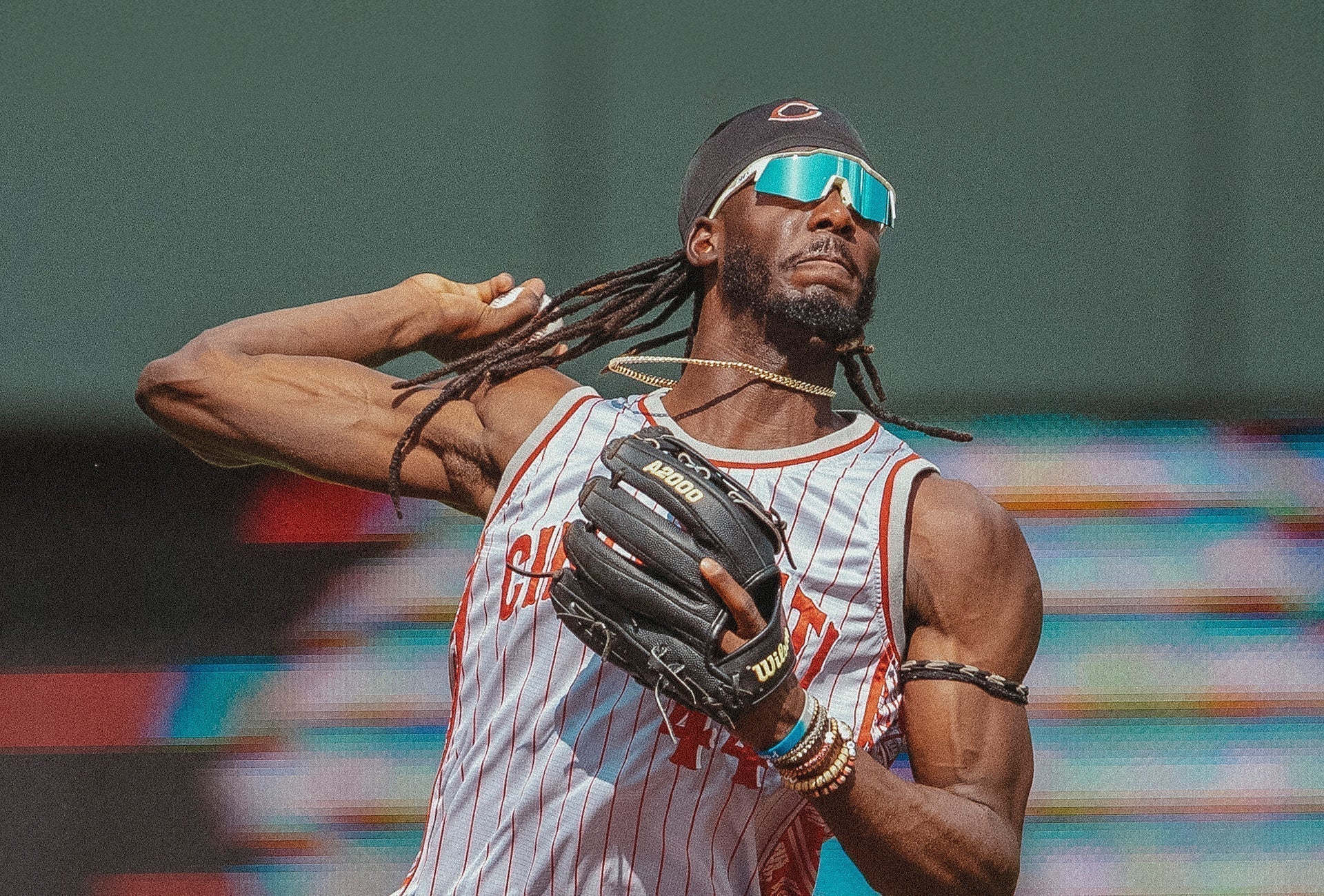 Elly De La Cruz wearing 100Percent® Speedcraft sunglasses throwing a ball from shortstop.