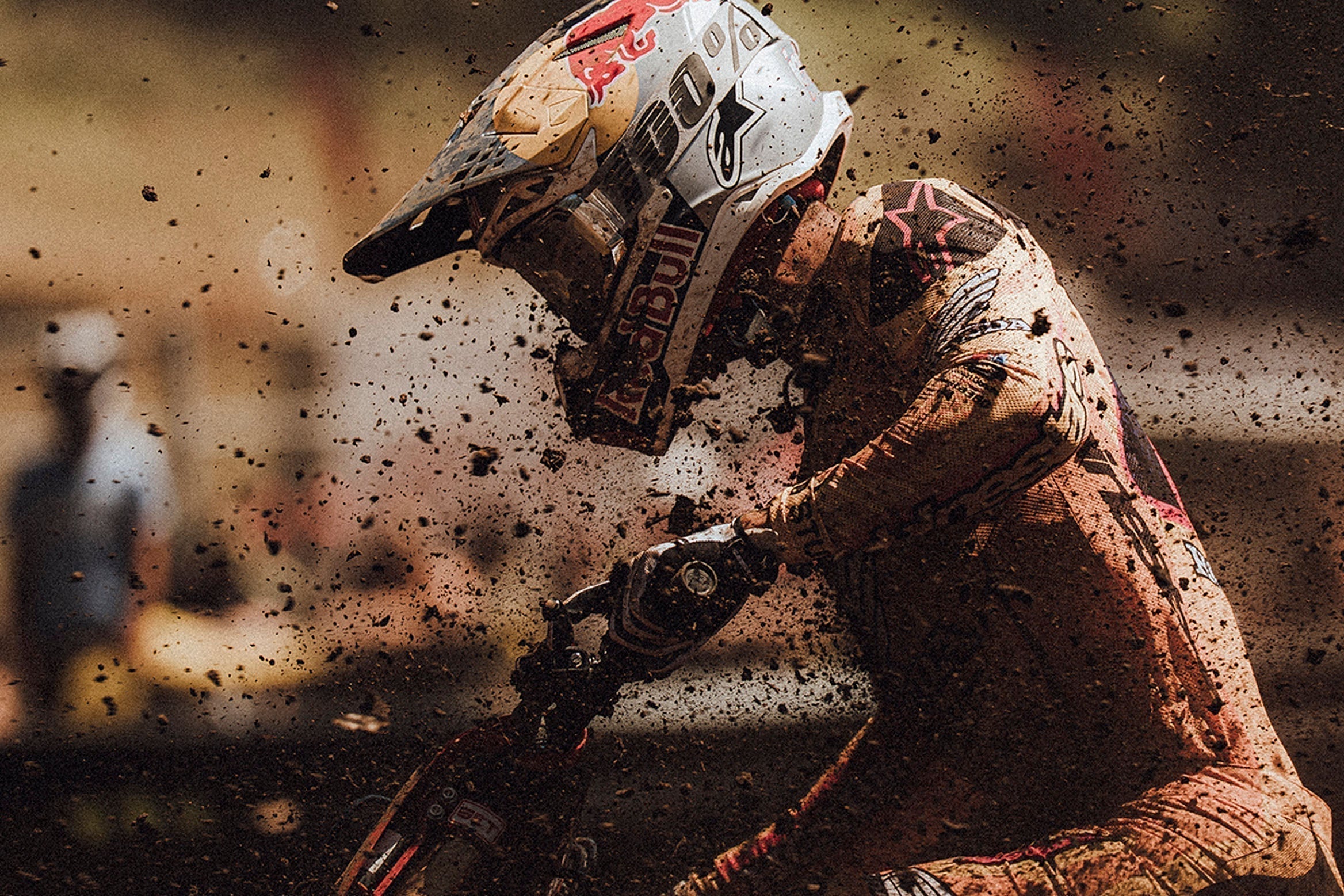 Close up photo of a rider covered in mud wearing 100Percent® 2026 Armega Goggle