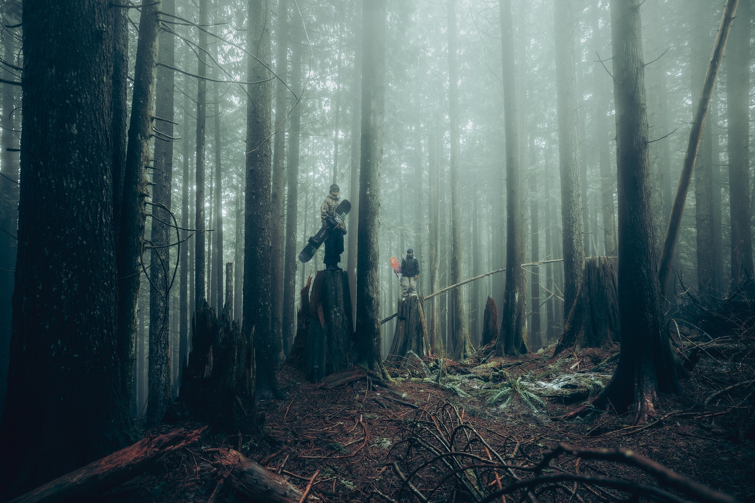 Snow athletes in a forest wearing 100Percent® Snow Goggles