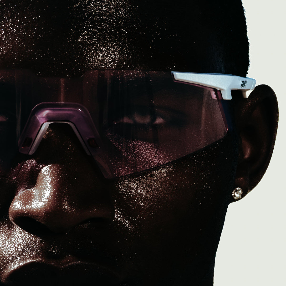 100Percent® A2 Running Sunglasses white on a man on a white background.