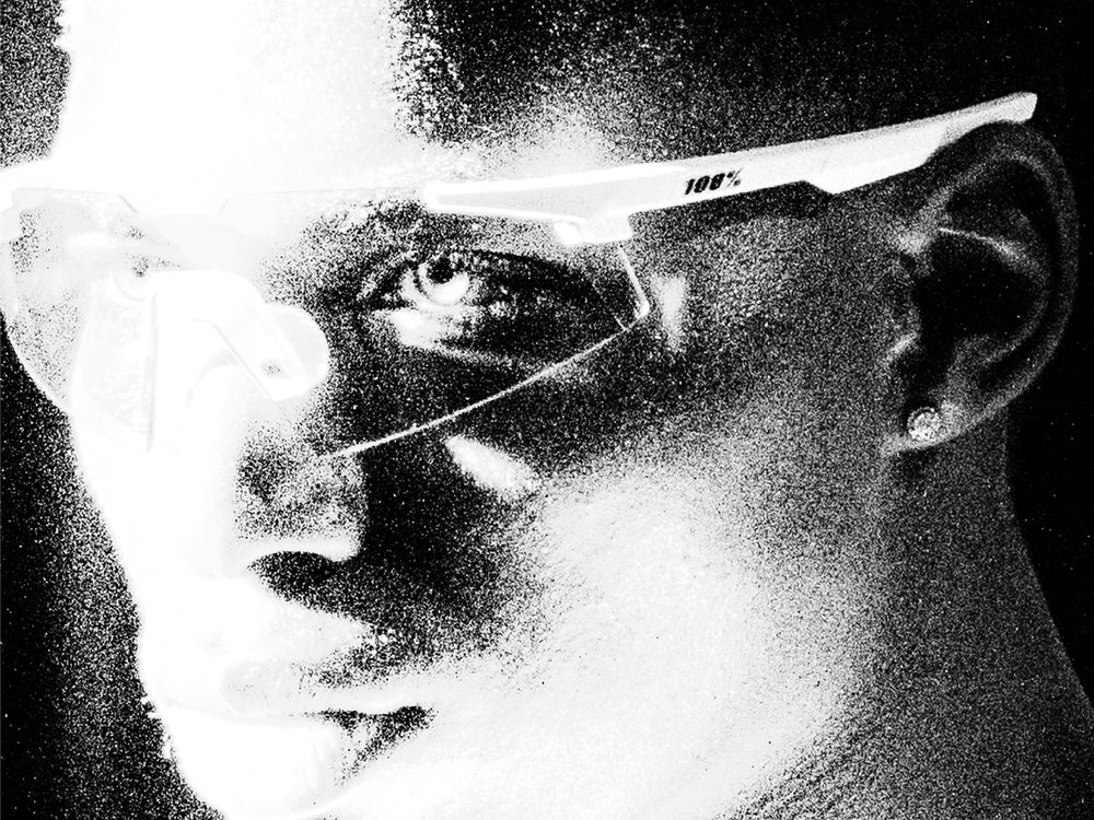 100Percent® A2 Running Sunglasses on a man on a grainy black/white background.