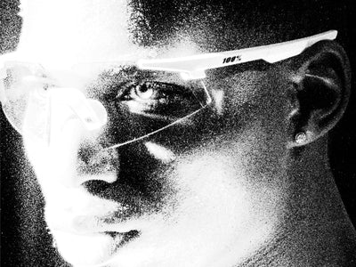 100Percent® A2 Running Sunglasses on a man on a grainy black/white background.