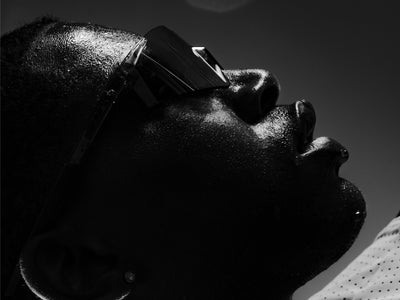100Percent® A2 Running Sunglasses on a man with a Black/White Background